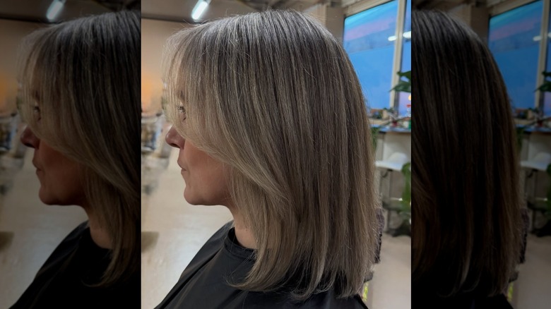 Une femme avec un lob droit et mélangé de gris