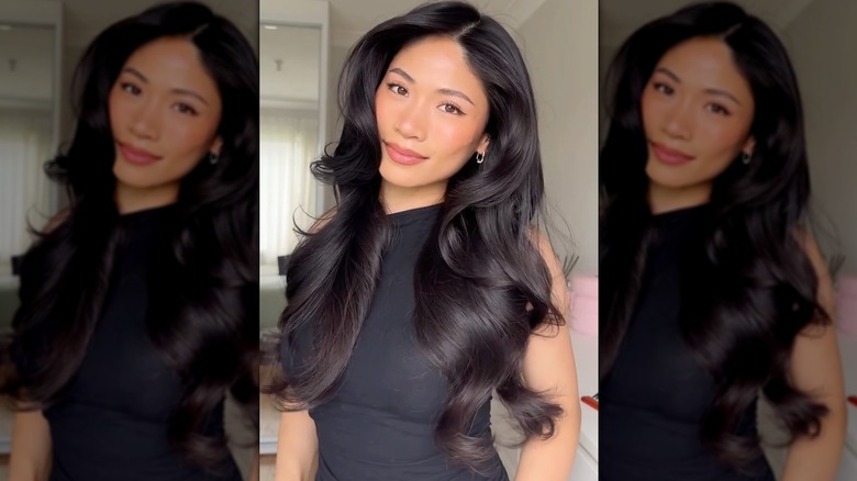 Une femme aux cheveux noirs dans une éruption volumineuse