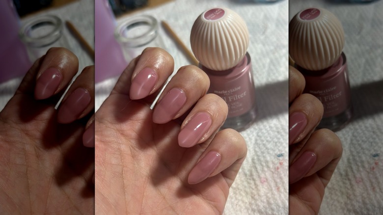 Une main semi-fermée avec en arrière-plan un flacon de vernis à ongles Marie Claire Paris montrant la teinte rose rosé de la marque