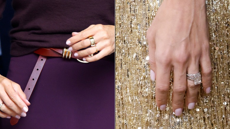 Un gros plan des mains de Meghan Markle et d'Amal Clooney avec vue sur leurs vernis à ongles et leurs bijoux